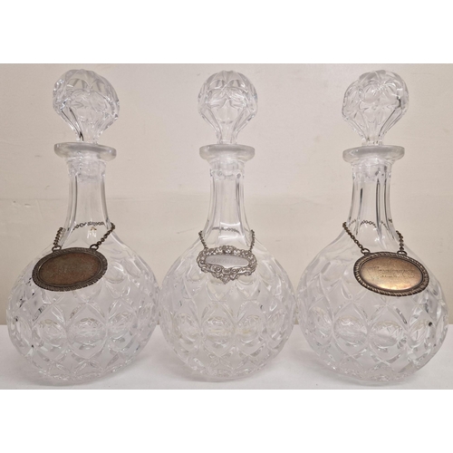 5854 - A mixed lot of drinkware. To include a set of three decanters, with silver-plated labels, a Bell's W... 