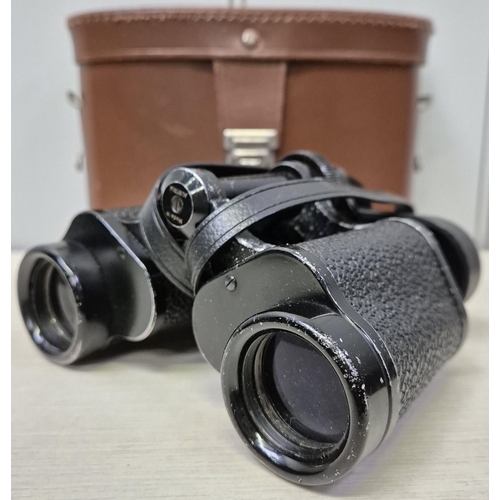 5903 - A pair of vintage Swarovski-Optik Tirol Falke 8x30 binoculars, with original leather case.