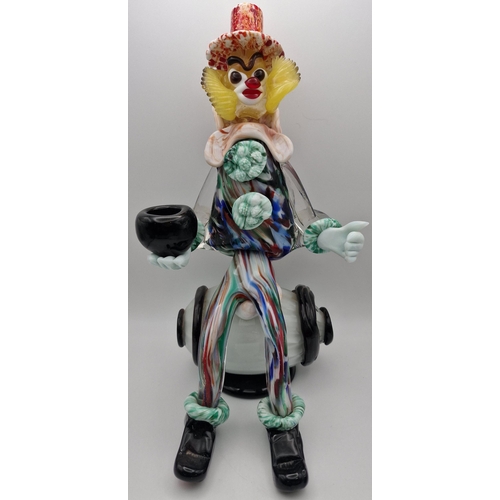 5974 - A vintage Murano barrel-seated clown figure. Dimensions(cm) H30.5, W16.5, D18.