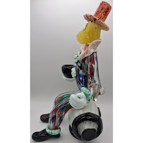 5974 - A vintage Murano barrel-seated clown figure. Dimensions(cm) H30.5, W16.5, D18.