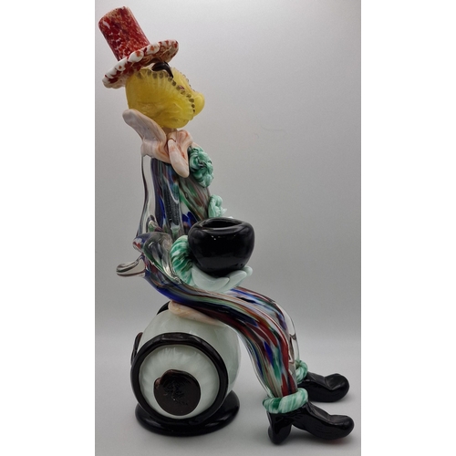 5974 - A vintage Murano barrel-seated clown figure. Dimensions(cm) H30.5, W16.5, D18.