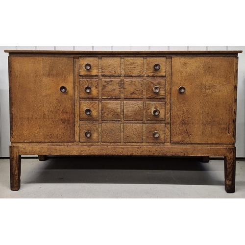 A Gordon Russell 1950's utility sideboard. Twin single-shelved cupboards, aside four central drawers. Dimensions(cm) H87, W141, D48.