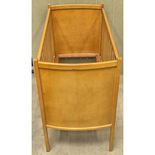 6236 - A mid-century child's cot. Dimensions(cm) H98, W122, D61.