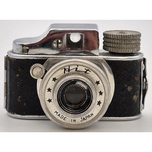 6275 - A rare Japanese miniature 'HIT' camera, with case & unusually, several rolls of unopened film. Dimen... 