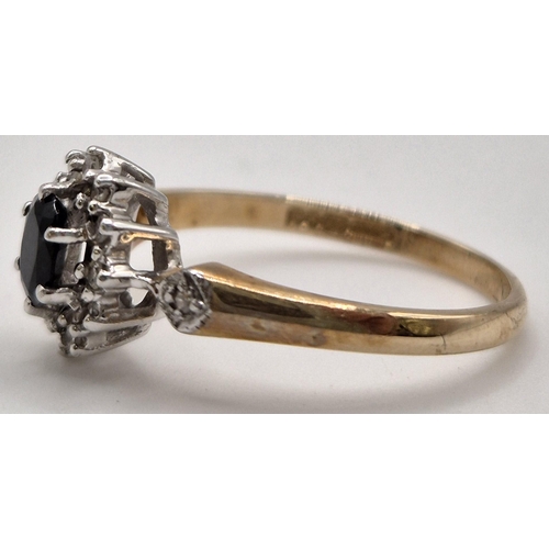 6337 - A hallmarked 9ct gold & sapphire, diamond engagement ring. Size L.