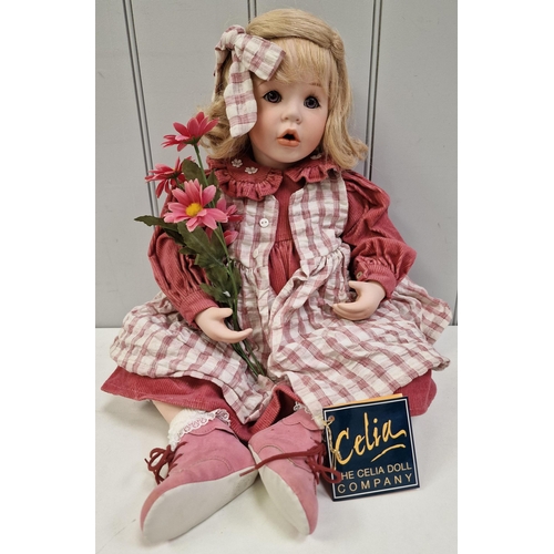 A boxed, fine porcelain, handmade 'Madeleine' collector's doll, by the Celia Doll Company. Limited edition 13/200. Height approx. 63cm.