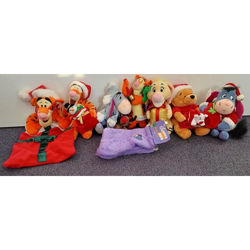 5985 - A collection of Winnie The Pooh Christmas items. To include soft toys (some Disney) & snuggly socks.