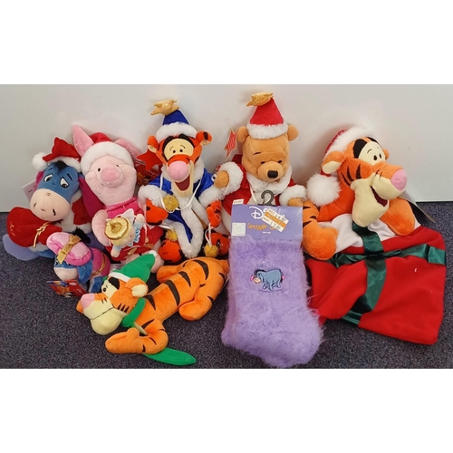 5986 - A collection of Winnie The Pooh Christmas items. To include soft toys (some Disney) & snuggly socks.