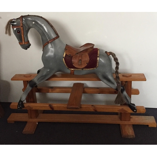 5622 - A vintage pine-based, grey rocking horse. Dimensions(cm) H92, L123, D38.