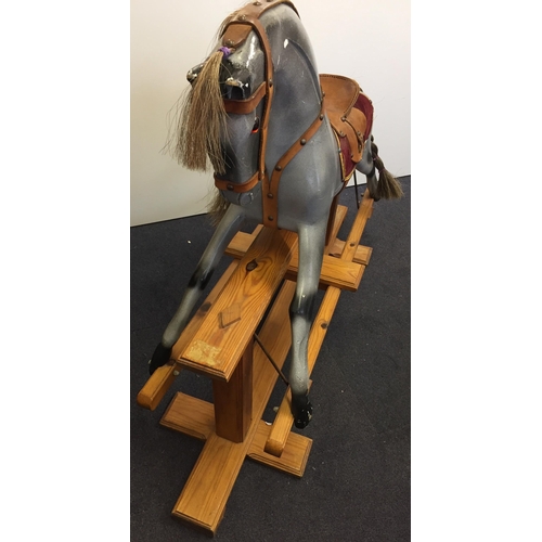 5622 - A vintage pine-based, grey rocking horse. Dimensions(cm) H92, L123, D38.