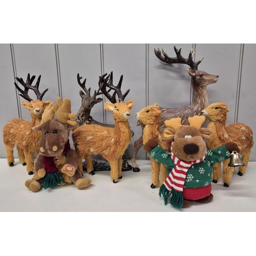 5897 - A collection of 8 Christmas reindeers. To include 2 ceramic, 2 stuffed & 4 straw. Tallest 40cm.