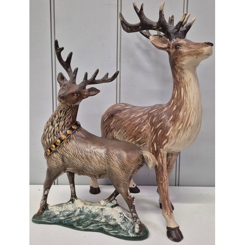 5897 - A collection of 8 Christmas reindeers. To include 2 ceramic, 2 stuffed & 4 straw. Tallest 40cm.