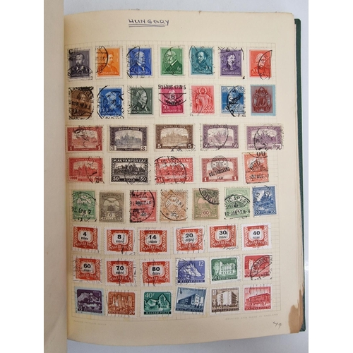 4806 - A vintage stamp album, containing a good quantity of worldwide stamps.