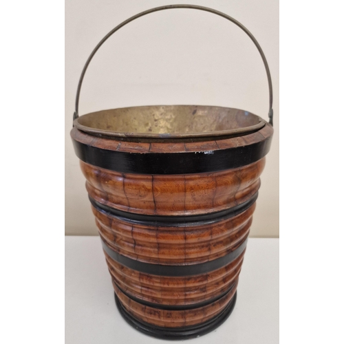 4807 - A duo of vintage Peat Buckets, with brass inners. To include a brass-bound oak example & an ebonised... 