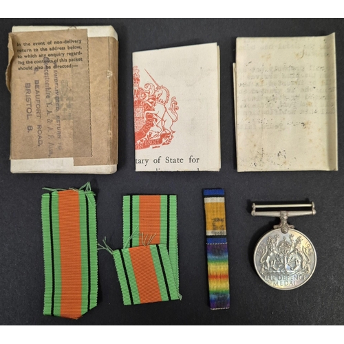 4827 - A WWII Defence Medal, with original paperwork. Awarded to Mr. J E Gay.