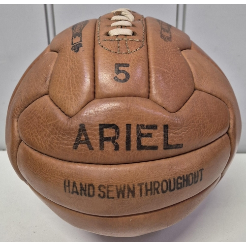 4854 - A trio of vintage sporting items. To include hand sewn leather 'Ariel' football & 'Super' rugby ball... 