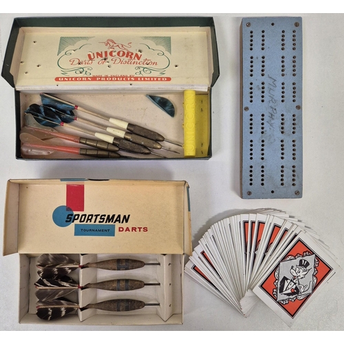 4856 - A mixed lot of leisure items. To include two sets of vintage darts, a metal fronted cribbage board, ... 