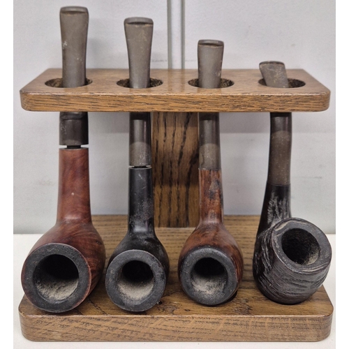 4859 - A vintage pipe rack, with 4 pipes.