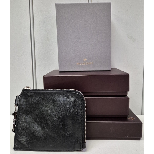 4863 - A collection of four boxed & one unboxed original Mulberry purses. Three with classic twist catches.