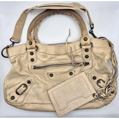 4885 - An original 'Balenciaga' motorcycle handbag, in cream leather.