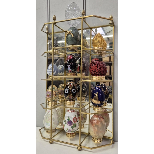 4887 - A set of Franklin Mint Collector's Eggs, with stand.