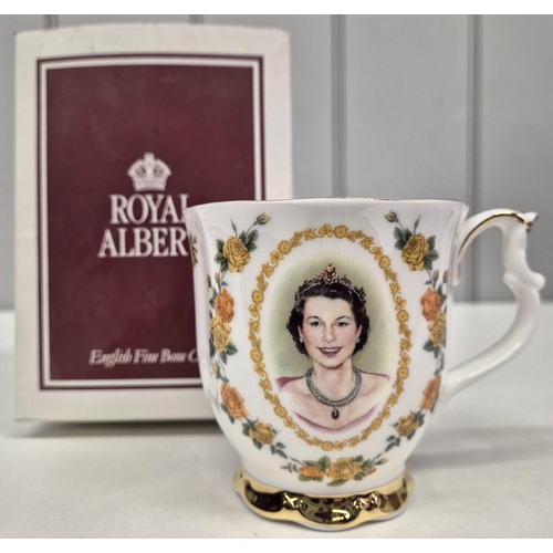 4957 - A collection of five pieces of Royal memorabilia. To include a boxed Royal Albert QEII Coronation mu... 