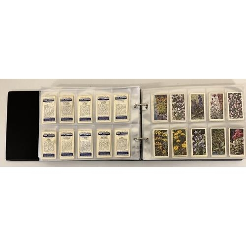 A cigarette card album, with 96 sleeves of full sets of cards.