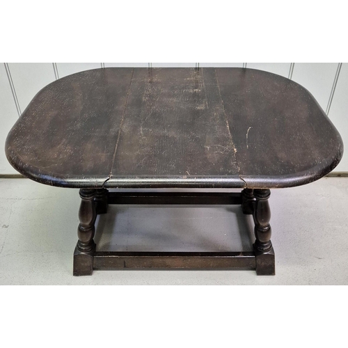 4844 - A vintage drop-leaf side table, together with a contemporary magazine rack. Respective dimensions(cm... 