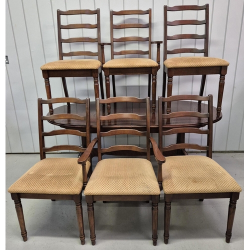 4852 - A vintage, walnut finish extending dining table, with six matching ladderback chairs. Table dimensio... 