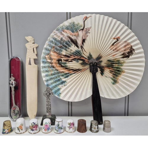 4881 - A mixed lot of vintage collectible items. To include thimbles, decorative cross, letter opener, book... 