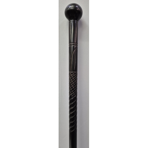 4921 - A vintage ebony walking stick, with knob handle. Length 90cm.