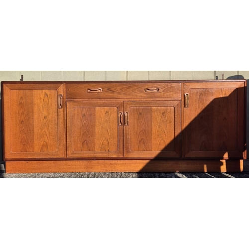 4931 - A mid-century teak, G-Plan lounge display cabinet. Features a glazed display area, bookcase & fall f... 