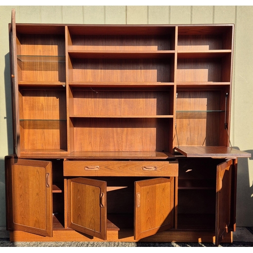 4931 - A mid-century teak, G-Plan lounge display cabinet. Features a glazed display area, bookcase & fall f... 