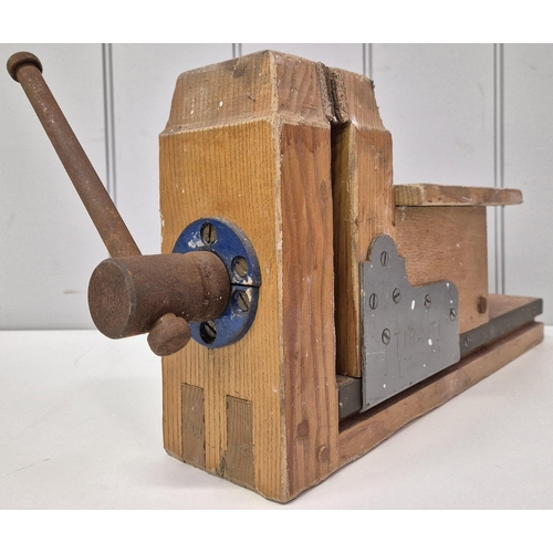 4965 - A wooden bench vice, by 'Tiranti', London. Dimensions(cm) H23, W48, D20.