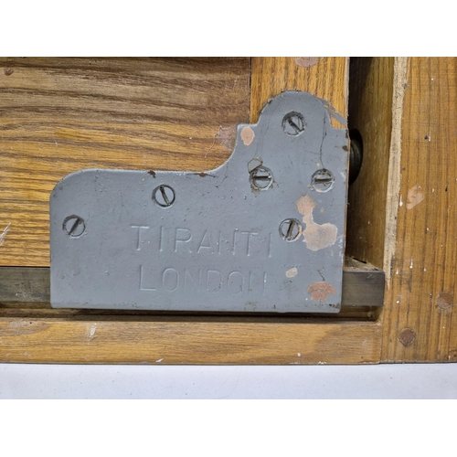 4965 - A wooden bench vice, by 'Tiranti', London. Dimensions(cm) H23, W48, D20.