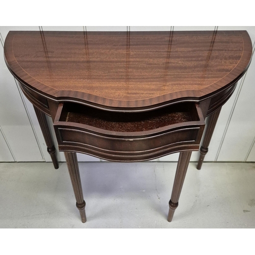 6309 - A mahogany-veneered demi lune occasional table, with single frieze drawer. Dimensions(cm) H76, W83, ... 