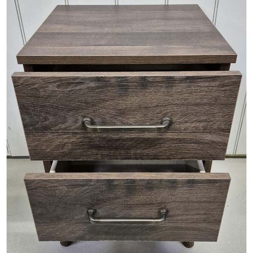 6310 - A contemporary, oak 2-drawer bedside table, with splayed legs. Dimensions(cm) H62, W43, D44.