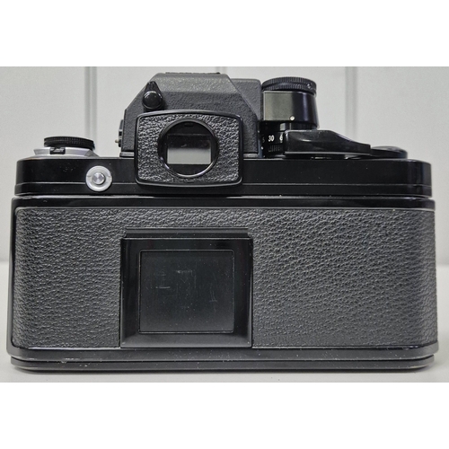 5975 - A professional Nikon F2 35mm SLR camera, with a huge range of accessories, to include six lenses, fl... 