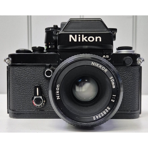 5975 - A professional Nikon F2 35mm SLR camera, with a huge range of accessories, to include six lenses, fl... 