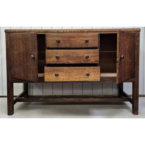 6331 - A 1950's walnut sideboard. Double cupboard aside triple drawers, raised on stretchered legs.
Dimensi... 