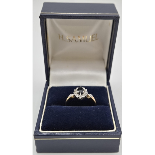 6337 - A hallmarked 9ct gold & sapphire, diamond engagement ring. Size L.