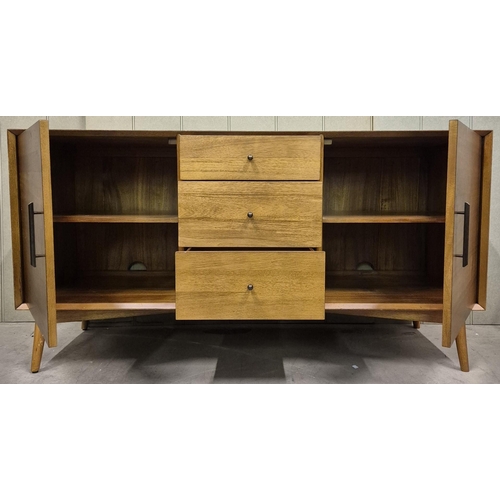 2 - A contemporary, 50's-style solid elm sideboard. Twin cupboards, aside a trio of central drawers, sup... 