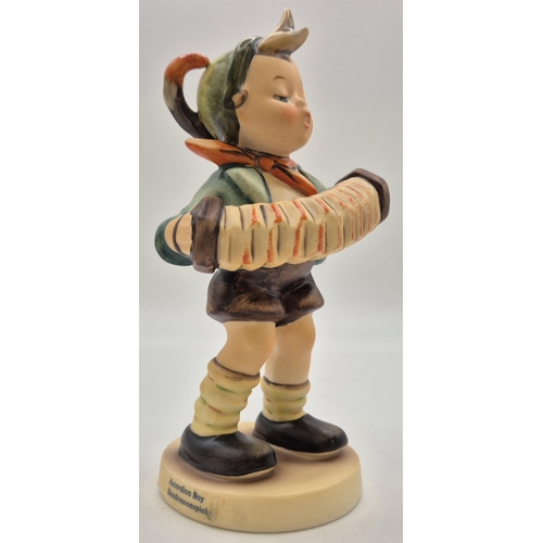 8 - A boxed Goebel 'Accordion Boy' figurine. Complete with certificate of authenticity. Height 14cm.