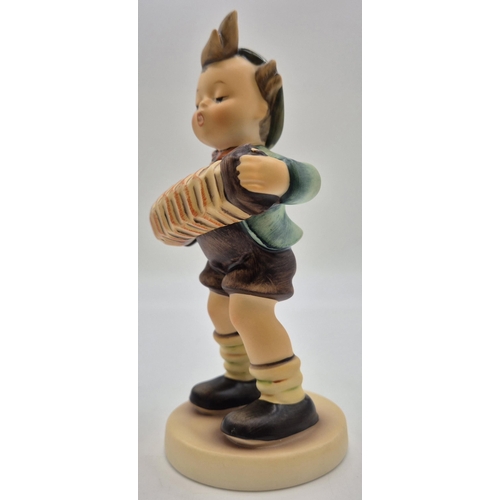 8 - A boxed Goebel 'Accordion Boy' figurine. Complete with certificate of authenticity. Height 14cm.