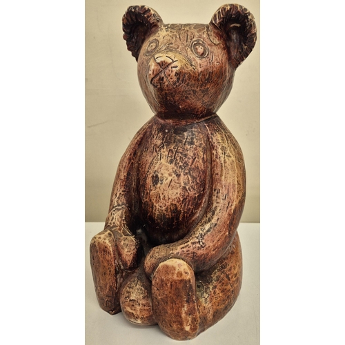 10 - A vintage carved 'Stickland Bear', by History Craft, together with a carved tree form. Respective di... 