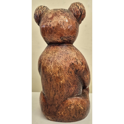 10 - A vintage carved 'Stickland Bear', by History Craft, together with a carved tree form. Respective di... 