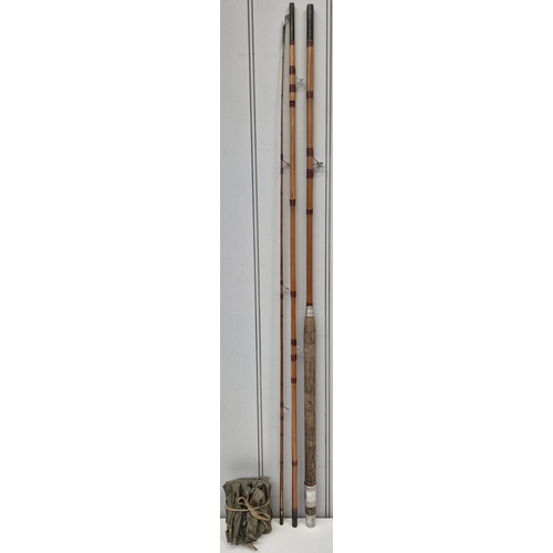 81 - A vintage 3-piece 10ft cane fishing rod, with cork handle. Complete with canvas carrybag.