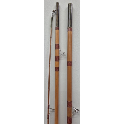 81 - A vintage 3-piece 10ft cane fishing rod, with cork handle. Complete with canvas carrybag.