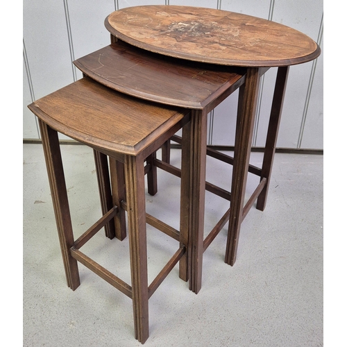 91 - A vintage nest of three tables. The larger being oval topped. Largest dimensions(cm) H57, W53, D35.