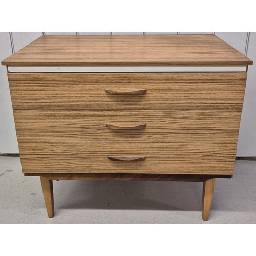 100 - A mid-century chest of three drawers, by 'Lebus'. Dimensions(cm) H68, W75, D43.